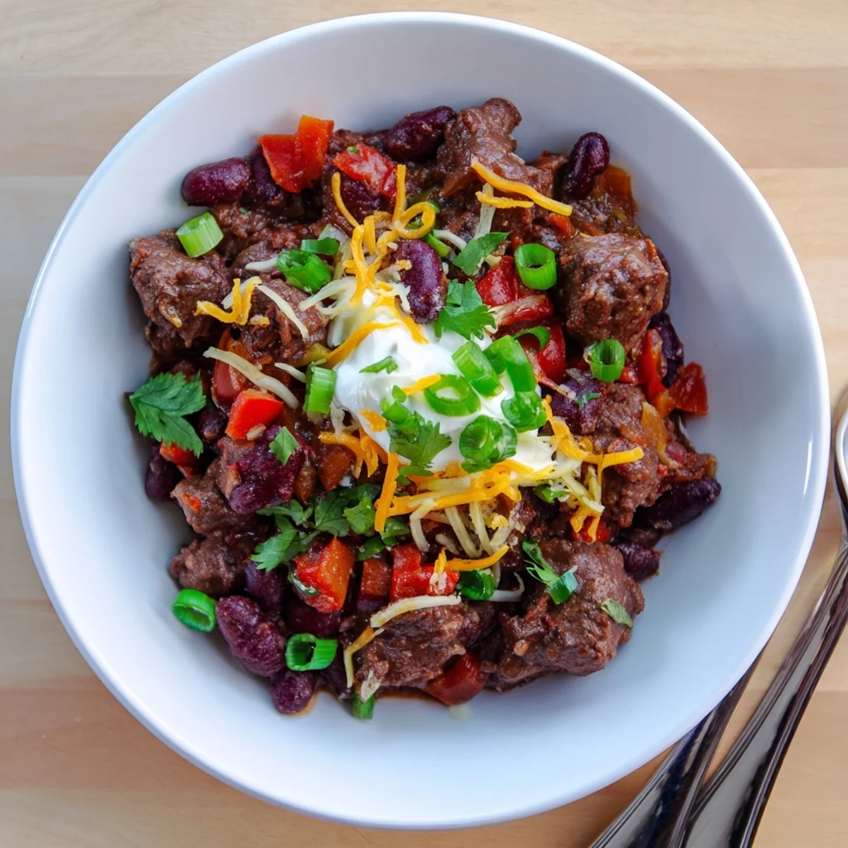 A warm bowl of Winter Warming Chili con Carne, with rich, smoky aromas ready to eat.
