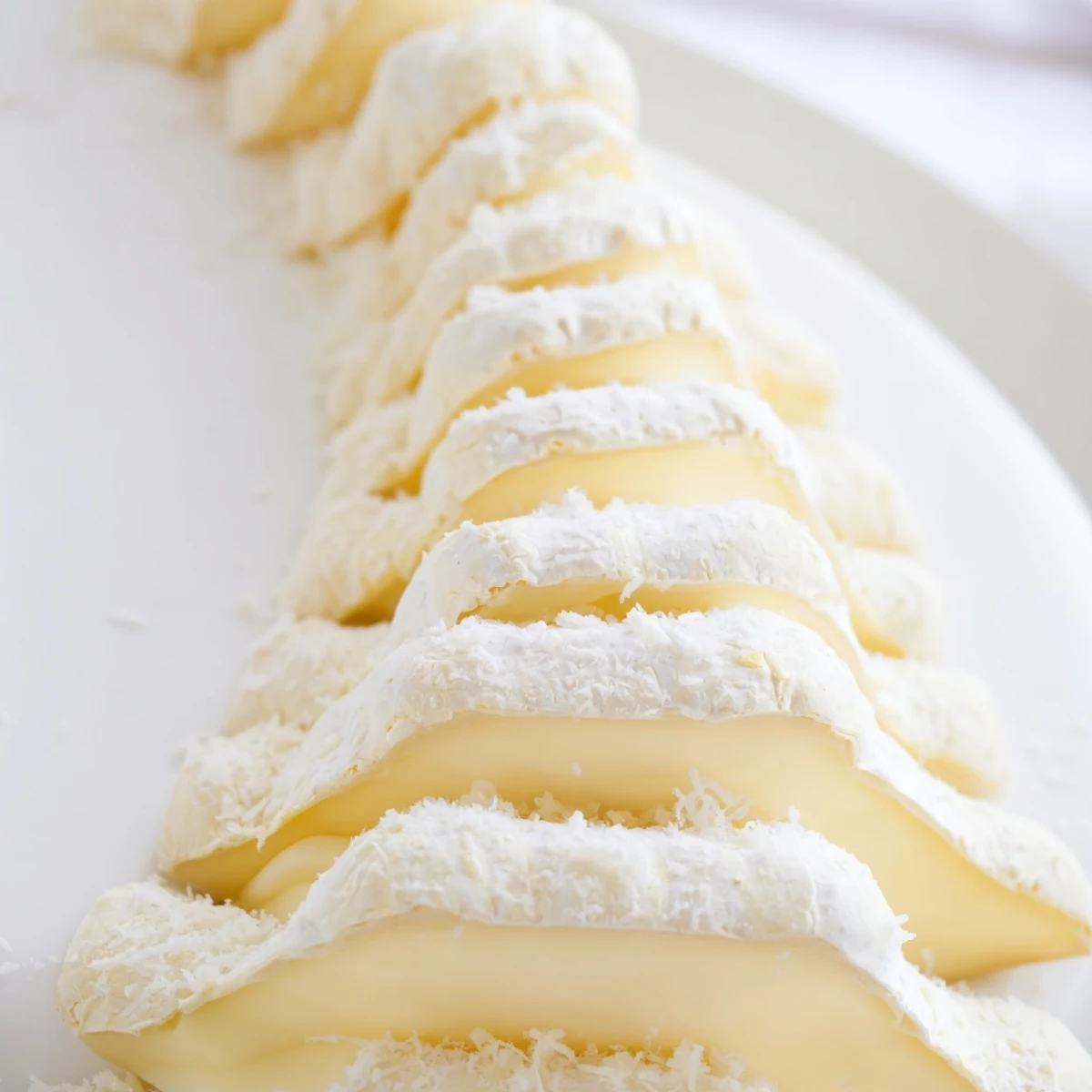 Beautiful serving of The Snowcapped Range: chilled Brie peaks dusted with Parmesan and ready to serve.