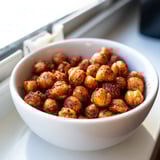 Golden Crispy Chickpea Snack roasted with smoky paprika and cumin, served warm in a rustic bowl.