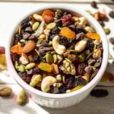 Fresh Trail Mix Custom arranged in a rustic bowl with dried cranberries and walnuts for a sweet and savory bite.  