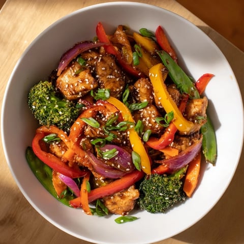 Sheet Pan Chicken Stir-Fry: a colorful medley of chicken and vegetables, glistening with savory sauce.