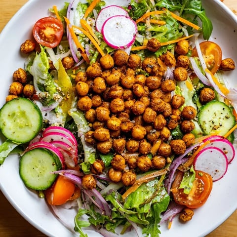 Golden-brown, crispy chickpea croutons top this Mixed Greens Salad for a delicious vegan lunch.