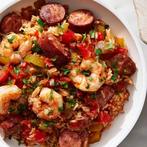Smoky sausage and shrimp are nestled in a flavorful Jambalaya Skillet with rice and vegetables.