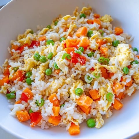 Scrumptious Egg Fried Rice with fluffy eggs and colorful vegetables, a quick weeknight dinner.