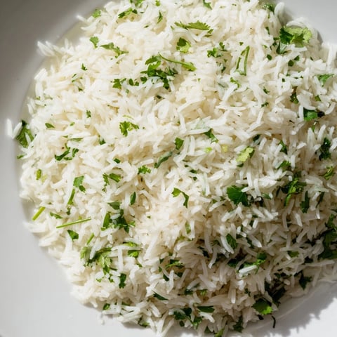 Fluffy Cilantro Lime Rice glistening, a vibrant side for tacos or grilling tonight.
