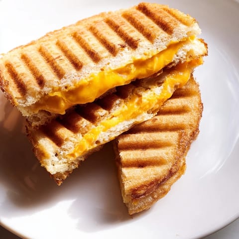 See the deliciously textured Waffle Grilled Cheese, ready to be dipped in hot tomato soup for dinner.