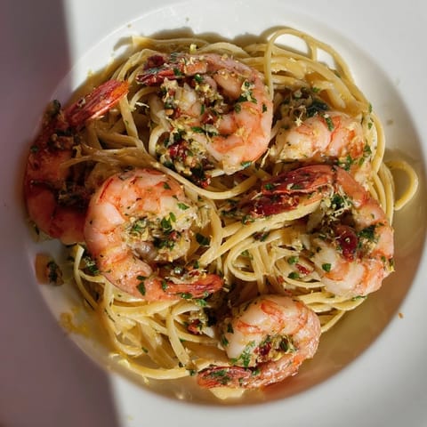 Succulent shrimp combined with flavorful lemon and herbs in the Lemon Herb Pasta, visually appealing.