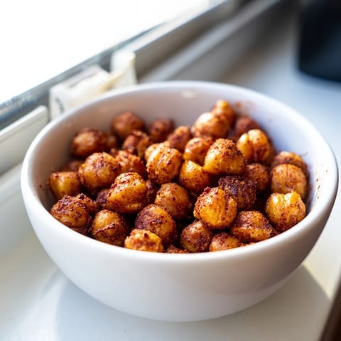 Golden Crispy Chickpea Snack roasted with smoky paprika and cumin, served warm in a rustic bowl.