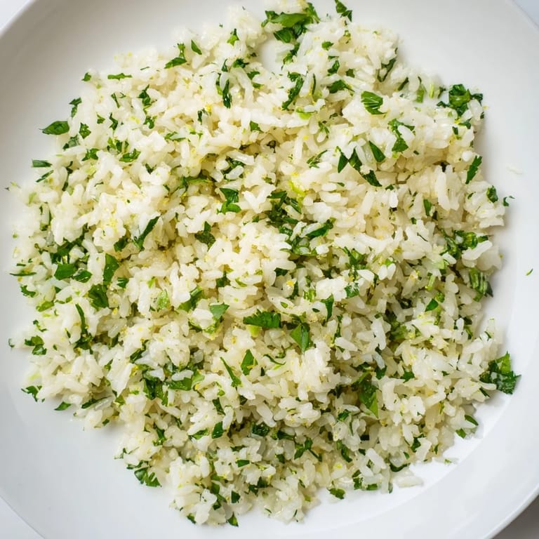 Steaming bowl of Cilantro Lime Rice, creamy, flavorful, perfect with your Mexican dinner.