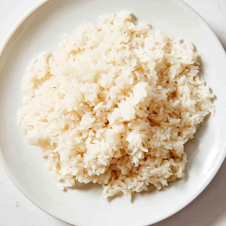 Savory Coconut Jasmine Rice, light and fluffy, perfectly complements grilled chicken and vegetable skewers.