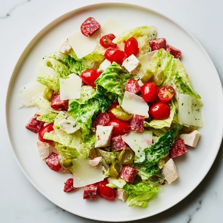Fresh Italian chopped chicken salad featuring cherry tomatoes, pepperoncini, and herbs, perfect for a light gluten-free lunch.