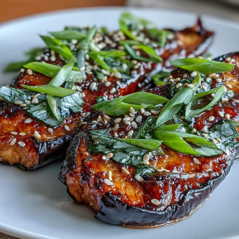 Roasted Miso Glazed Eggplant served warm over white rice for a savory vegan dinner.