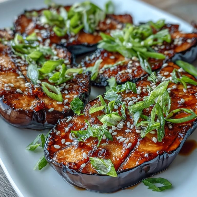 Freshly broiled Miso Glazed Eggplant brushed with a sweet-savory glaze, glistening with sesame oil.