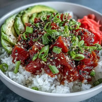 Spicy Tuna Pickle Rice Bowl: colorful toppings atop seasoned rice, ready for lunch.